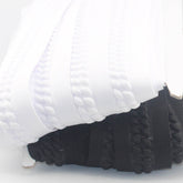 2 meter Elastic Trimming 45mm (with 20mm embossed design) available in Black or White - ACCESSOIRES LEDUC BV