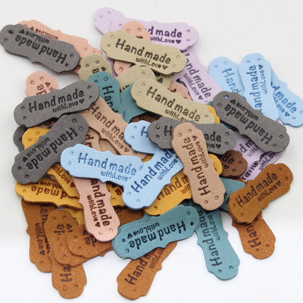 Set of 7 Fake Suede Labels - Peanut Shape - tagged "Handmade with ♥" - size40x15mm (Sew-on)